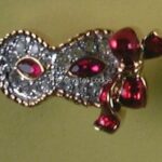 Swarovski_2000_event_pin_mask_Columbine_red_1_WM Swarovski_2000_event_pin_mask_Columbine_red | The Crystal Lodge
