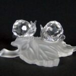 Swarovski_snails_babies_on_vine_leaf_268196_1_WM Swarovski_snails_babies_on_vine_leaf_268196 | The Crystal Lodge